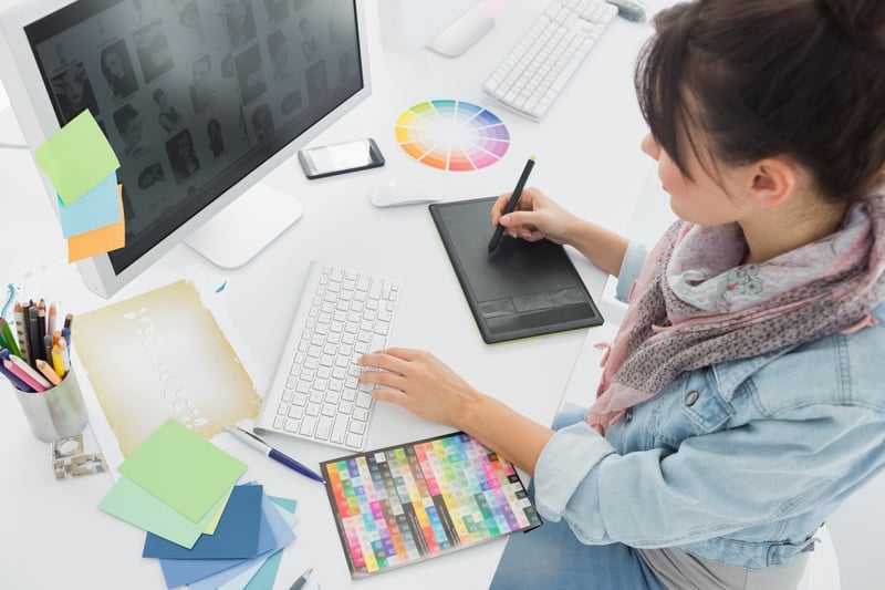 High angle view of an artist drawing something on graphic tablet at the office.jpeg